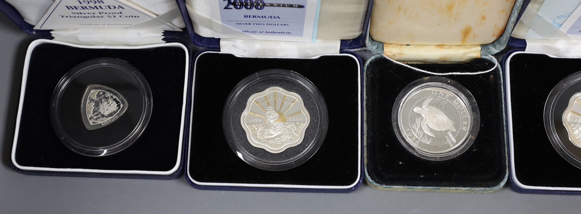 A group of boxed Bermuda silver coins